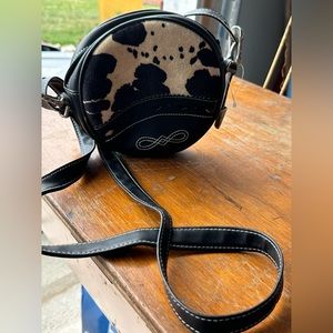 Vintage round JouJou zip up purse looks like a cow skin on front never used